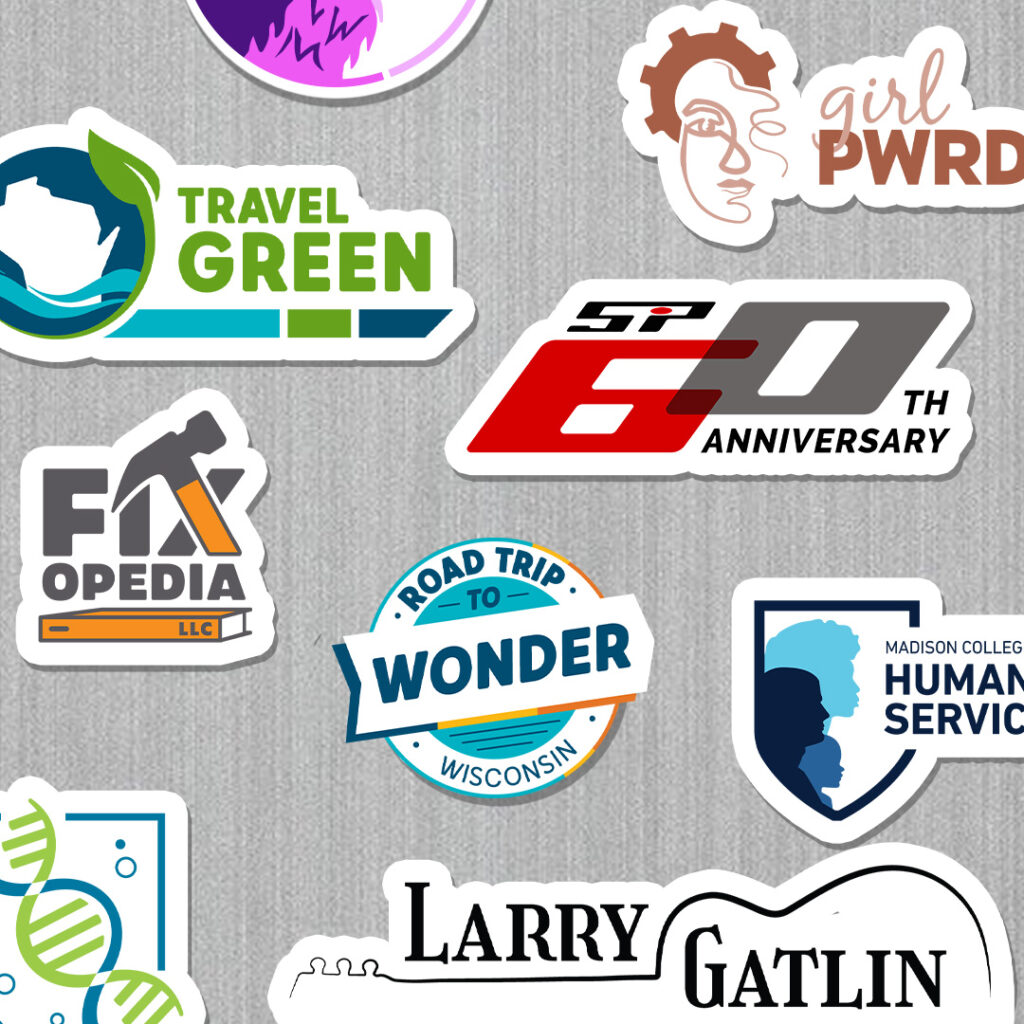 Collection of logos designs turned into stickers on a laptop